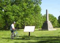 Cyclist learning about Meriwether Lewis.