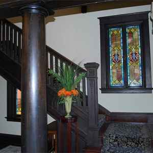 A beautiful, wooden staircase takes you to the upstairs guest rooms.