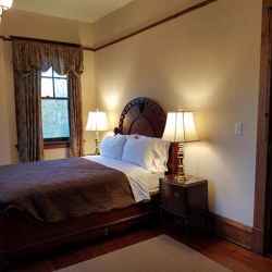 Mahogany Room with a queen size bed.
