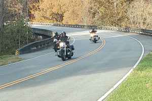 Motorcycles on the Curvy Treetop Bridge - milepost 436